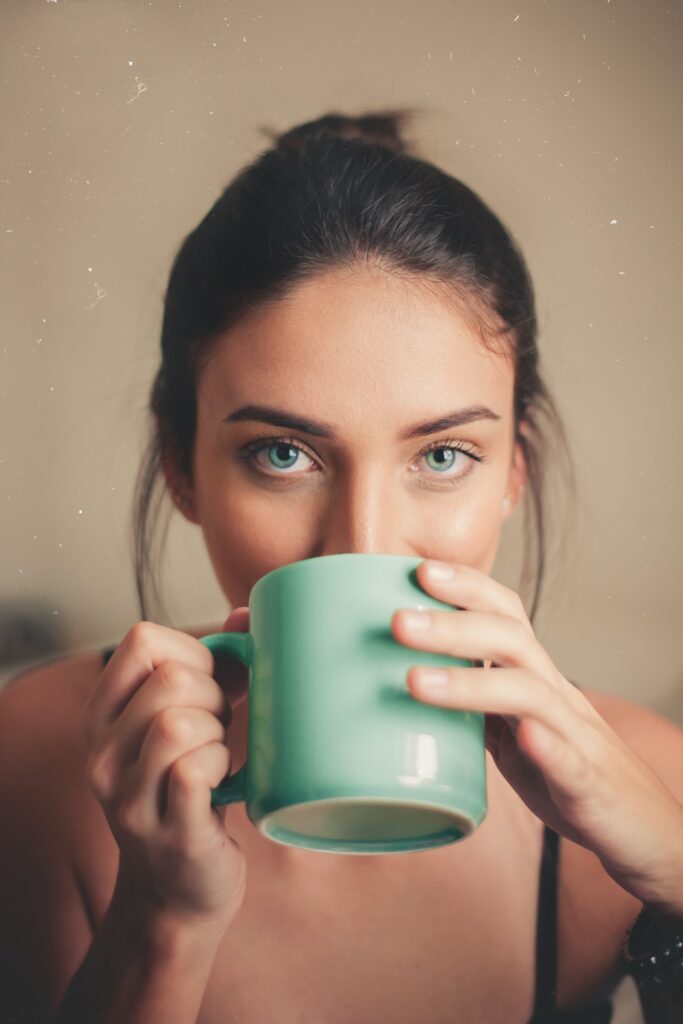 Woman with coffee cup.